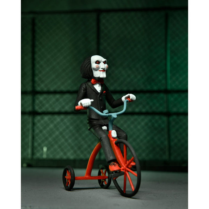 NECA Figura de Accion Tony Terrors: Saw - Set Asesino Jigsaw Y Marioneta Billy EnTriciclo 6 Pulgadas